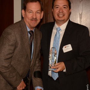 ACDL Director J.J. Rico presenting award to event attendee