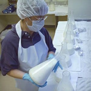 Woman processing breastmilk in sterile lab